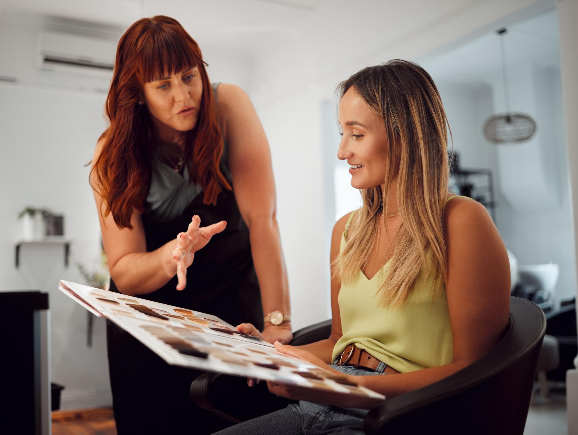 salon hair beauty with woman customer hairdresser with stylist choosing color fashion studio client